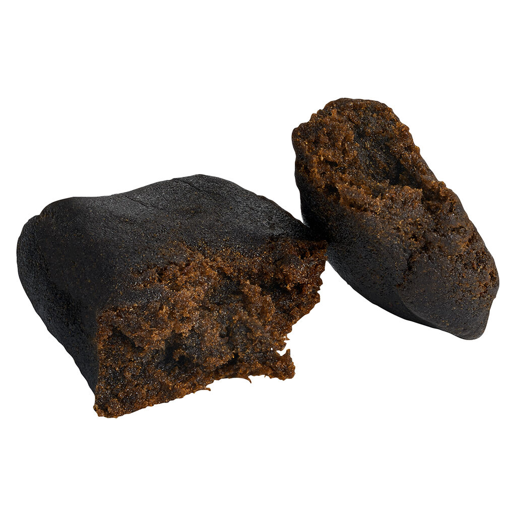 3Saints Single Source Hash broken open, showing a dark outer layer with a soft, sticky, resin-rich interior.