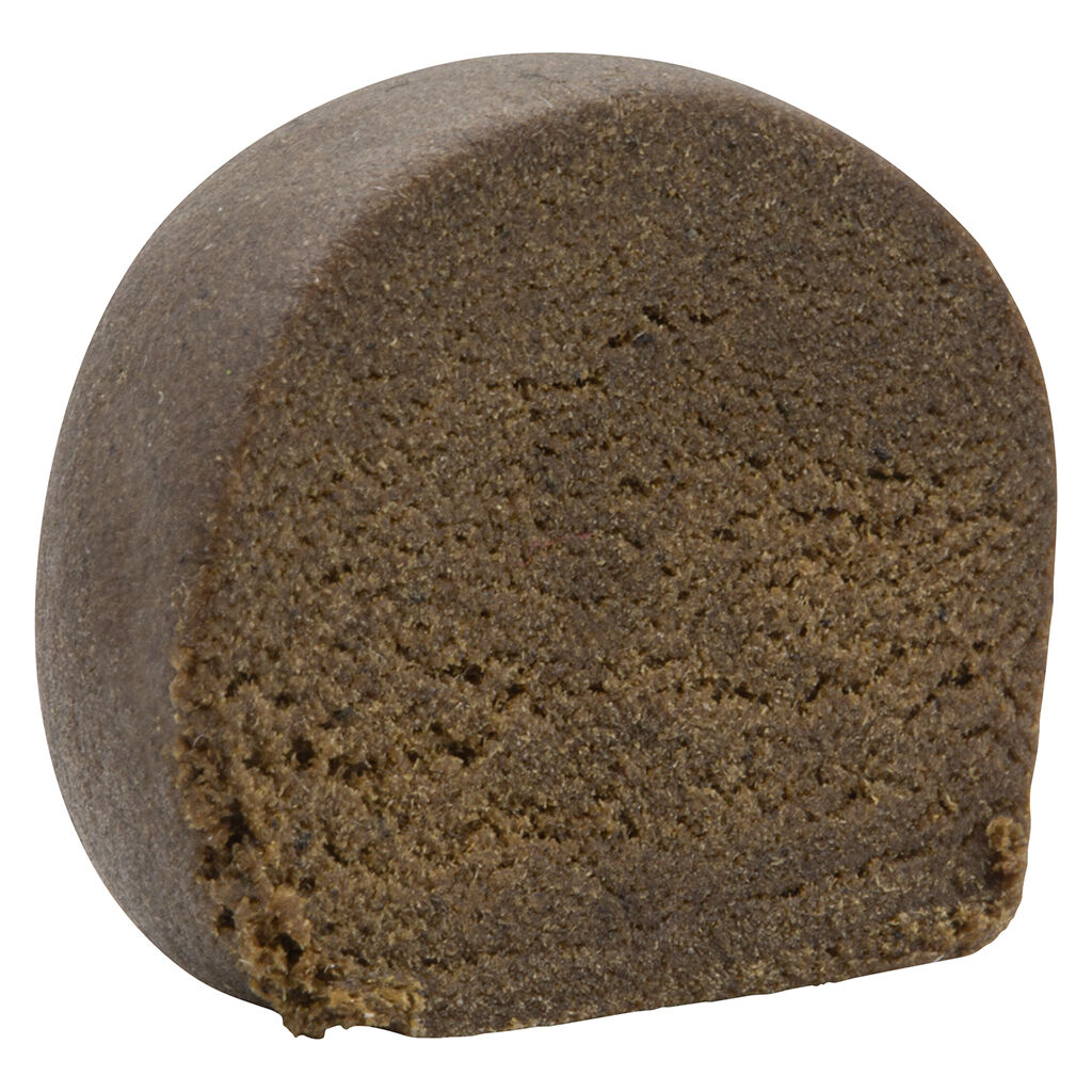 Close-up of Jublee Montreal Style Aged Hash showing smooth exterior and soft, crumbly interior.