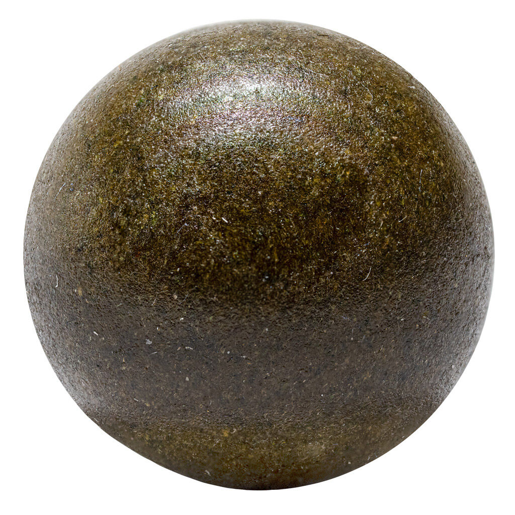 Close-up of Nugz Old School Hash showing smooth, dark pressed exterior with dense texture.